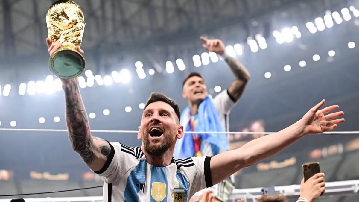 Messi with the World Cup trophy in 2022